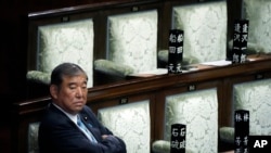 Japanese Prime Minister Shigeru Ishiba waits after the first vote for a new prime minister at a special parliamentary session of the lower house, Nov. 11, 2024, in Tokyo.