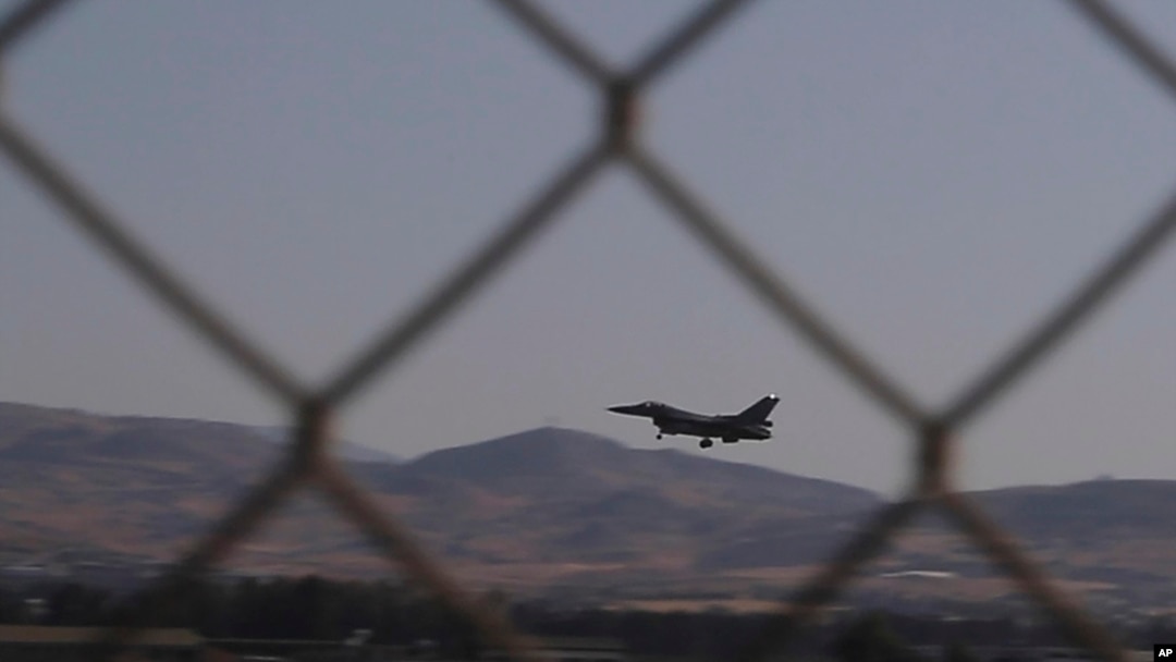 FILE - In this image taken from video, a Greek Air Force F-16 aircraft lands at Cyprus' Andreas Papandreou Air Base near the southwestern coastal city of Paphos, Cyprus, Aug. 25, 2020. 