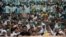 People attend a Maha Panchayat or grand village council meeting as part of a farmers' protest against farm laws in Muzaffarnagar in the northern state of Uttar Pradesh, India, Sept. 5, 2021.