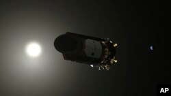 This illustration made available by NASA shows the Kepler Space Telescope. As of October 2018, the planet-hunting spacecraft has been in space for nearly a decade. 