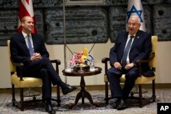 Britain's Prince William meets Israeli's President Reuven Rivlin, right, Tuesday, June 26, 2018 in Jerusalem.