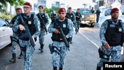 Members of National Force patrol a street during a military police strike in Fortaleza, Brazil, Feb. 21, 2020.