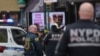 Law enforcement officers work near the scene of a shooting at a subway station in the Brooklyn borough of New York City, New York, U.S., April 12, 2022.