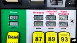 FILE - Gasoline prices are displayed at a gas station in Marietta, Ga., Apr. 8, 2022. 