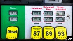 FILE - Gasoline prices are displayed at a gas station in Marietta, Ga., Apr. 8, 2022. 