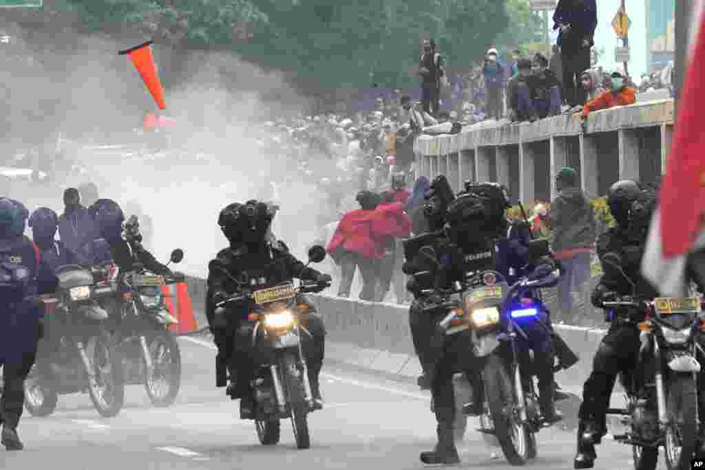 Police disperse protesters during a rally in Jakarta, Indonesia.&nbsp;Thousands of students marched in cities around the country to protest against rumors that the government is considering postponing the 2024 presidential election to allow President Joko Widodo to remain in office beyond the two-term legal limit, calling it a threat to the country&#39;s democracy.
