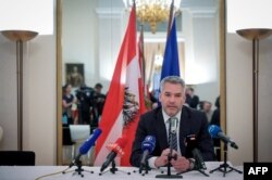Austrian Chancellor Karl Nehammer speaks during a press conference at the Austrian embassy in Moscow, April 11, 2022.