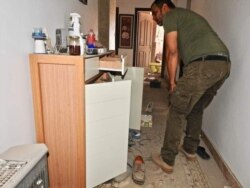 Wasef Gelani searches for explosives in his house in Tripoli, Libya, June 6, 2020. (Photo courtesy of Wasef Gelani)