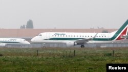 Alitalia planes ready to take off at Linate airport in Milan, Italy, Oct. 10 ,2013. 