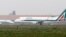 Alitalia planes ready to take off at Linate airport in Milan, Italy, Oct. 10 ,2013. 