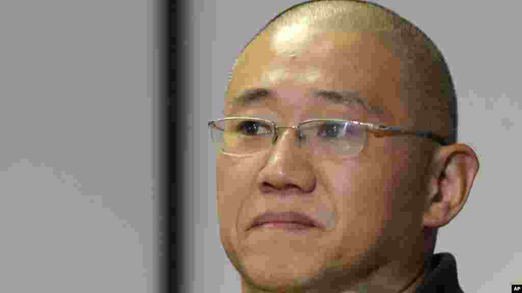 Kenneth Bae, who had been held in North Korea since 2012, waits to talk to reporters at Joint Base Lewis-McChord, Washington, Nov. 8, 2014.