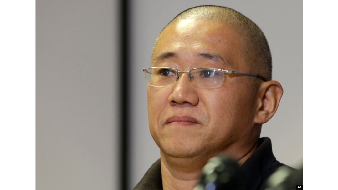 FILE - Kenneth Bae talks to reporters at Joint Base Lewis-McChord, Washington, Nov. 8, 2014.