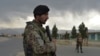 Afghan National Army (ANA) soldiers stand guard at a checkpoint near the a US military base in Bagram, some 50 kilometers north of Kabul, on April 29, 2021. 