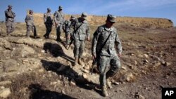 FILE - U.S. Army soldiers tour St. Elijah's Monastery on Forward Operating Base Marez in Mosul, Iraq.