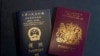 FILE - In this Jan. 29, 2021, file photo, a British National Overseas passports (BNO) and a Hong Kong Special Administrative Region of the People's Republic of China passport are pictured in Hong Kong. 