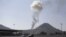 Smoke rises from an army weapons depot hit by a Saudi-led air strike in al-Nahdain mountain in Yemen's capital Sana'a, Oct.25, 2015.