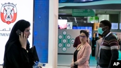 A man wears a mask as he visits the UAE ministry stand during the Arab Health Exhibition in Dubai, United Arab Emirates, Jan. 29, 2020. 