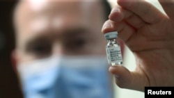 A pharmacist displays an ampoule of dexamethasone at the Erasme Hospital amid the coronavirus disease (COVID-19) outbreak, in Brussels, Belgium, June 16, 2020.