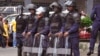 FILE - Liberia security forces in riot gear in the city of Monrovia, Liberia, Aug. 20, 2014. 