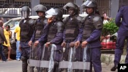 FILE - Liberia security forces in riot gear in the city of Monrovia, Liberia, Aug. 20, 2014. 