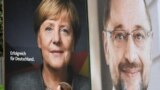 Election posters of German Chancellor Angela Merkel of the Christian Democratic Party CDU and Social Democratic Party SPD leader and top candidate Martin Schulz are seen in Hamburg, Sept. 24, 2017.