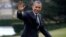  President Barack Obama waves following his arrival on Marine One helicopter from the House Democratic Issues Conference in Lansdowne, Virginia, as he walks across the South Lawn of the White House in Washington, February 7, 2013.