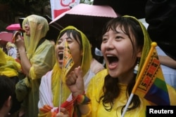 Same-sex marriage supporters shout during a parliament vote on three draft bills of a same-sex marriage law, outside the Legislative Yuan in Taipei, Taiwan, May 17, 2019.