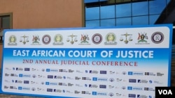 FILE - A sign is seen outside the East African Court of Justice. The Pan African Lawyers Union filed a complaint at the EACJ against the Kenyan and South Sudanese governments in connection with the disappearance of South Sudanese refugee Morris Mabior. (Photo by Asraji Mvungi)