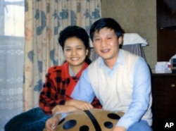 FILE - This photo provided by China's Xinhua News Agency, shows Communist Party Leader Xi Jinping and his wife Peng Liyuan in Sept. 1989.