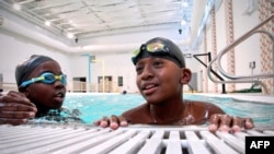 Students of Bishop John T. Walker School for Boys attend a free swimming lesson at Ferebee-Hope Aquatic Center in Washington, Oct. 12, 2022.