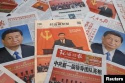 Newspaper reports on the new Politburo Standing Committee led by Chinese President Xi Jinping, following the 20th National Congress of the Communist Party of China, are seen in this illustration picture taken Oct. 24, 2022.