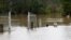 FILE - A gate and letterbox are seen at a flooded residential area near the overflowing Nepean River after torrential rain in western Sydney, Australia, July 5, 2022. Sydney could break a 72-year-old one-year rainfall record on Oct. 7 or 8, 2022, forecasters say.