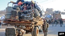 Syrians refugees prepare to leave Lebanon towards Syrian territory through the Wadi Hamid crossing in Arsal.