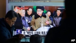FILE - People watch a TV news program showing North Korean leader Kim Jong Un with superimposed letters that read: "North Korea has made nuclear warheads small enough to fit on ballistic missiles" at Seoul Railway Station in Seoul, South Korea, March 9, 2016. 