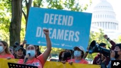 FILE - People rally outside the Capitol in support of the Deferred Action for Childhood Arrivals (DACA), during a demonstration on Capitol Hill in Washington, Oct. 6, 2022.
