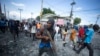 FILE - Protesters demand the resignation of Prime Minister Ariel Henry in Port-au-Prince, Haiti, Oct. 3, 2022. Because Haiti failed to hold legislative elections since 2019, there are no lawmakers to fill the seats of the 10 lawmakers whose terms expired on Jan. 10, 2023.