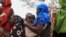 FILE - Internally displaced Ethiopians queue to receive food aid in the Higlo camp for people displaced by drought, in the town of Gode, Somali Region, Ethiopia, Apr. 26, 2022. 