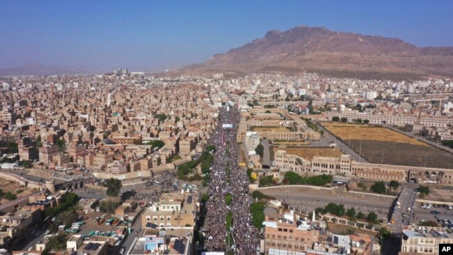 FILE - Houthi supporters attend a rally marking the seventh anniversary of the Saudi-led coalition's intervention in Yemen's war, in Sanaa, Yemen, March 26, 2022. (AP Photo/Abdulsalam Sharhan, File)