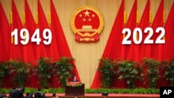 Chinese Premier Li Keqiang gives a speech during a dinner reception at the Great Hall of the People on the eve of the National Day holiday in Beijing, Sept. 30, 2022.