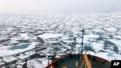 FILE - This 2018 photo from the National Oceanic and Atmospheric Administration shows the U.S. Coast Guard Icebreaker Healy in the Chukchi Sea of the Arctic Ocean. The U.S. Commerce Department and NOAA announced Friday funding to improve Arctic climate data collection.