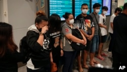 Malaysian youths rescued from human traffickers in Cambodia arrive at the Kuala Lumpur Airport Terminal in Sepang, Oct. 6, 2022. Another 21 Malaysians rescued from human traffickers in Cambodia and Laos returned to the country Thursday.