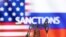 A model of a pump jack is seen in front of the displayed word "Sanctions;" U.S. and Russian flag colors in this illustration taken March 8, 2022. (Dado Ruvic/REUTERS)