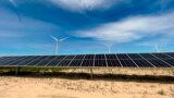 In this image provided by Portland General Electric, windmills and solar panels line a renewable energy facility in Lexington, Oregon, May 24, 2022. 