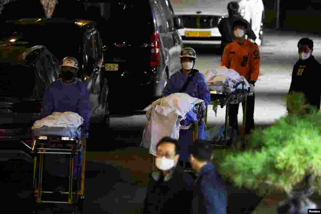 People move bodies to be transported from hospital, after a stampede during a Halloween festival in Seoul, South Korea. At least 151 people were killed and&nbsp;82 people were injured in the incident in Seoul&#39;s Itaewon area, which had been packed with crowds ahead of the Monday holiday, officials said.