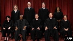 FILE - The current U.S. Supreme Court sits for its official photo in Washington, Oct. 7, 2022. 