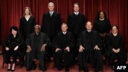 FILE - Justices of the U.S. Supreme Court pose for their official photo at the court in Washington, Oct. 7, 2022.