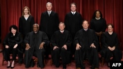 Justices of the US Supreme Court: Seated from left, Associate Justice Sonia Sotomayor, Associate Justice Clarence Thomas, Chief Justice John Roberts, Associate Justice Samuel Alito and Associate Justice Elena Kagan, (Standing behind from left) Associate Justice Amy Coney Barrett, Associate Justice Neil Gorsuch, Associate Justice Brett Kavanaugh and Associate Justice Ketanji Brown Jackson.