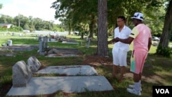 Isaiah Roberts, Morris' Father, showing Morris his grandparents' grave in Callahan, Florida.