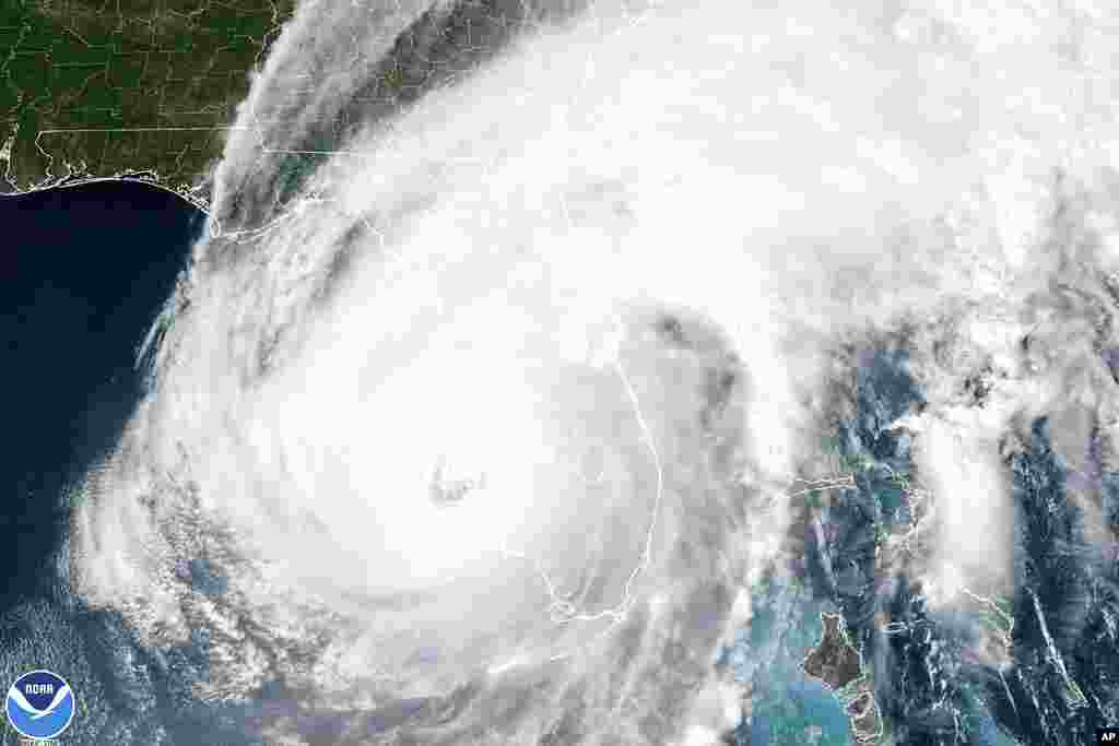This satellite image taken at 3:06 p.m. EDT and provided by NOAA shows Hurricane Ian making landfall in southwest Florida near Cayo Costa, Florida, on Sept. 28, 2022, as a catastrophic Category 4 storm. 
