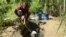FILE - A boy fetches water from a borehole for domestic use at Mbopo ward, where there is no access to a public water supply, in Dar es Salaam, Tanzania, March 21, 2020. Rains have been short in East Africa since late 2020.